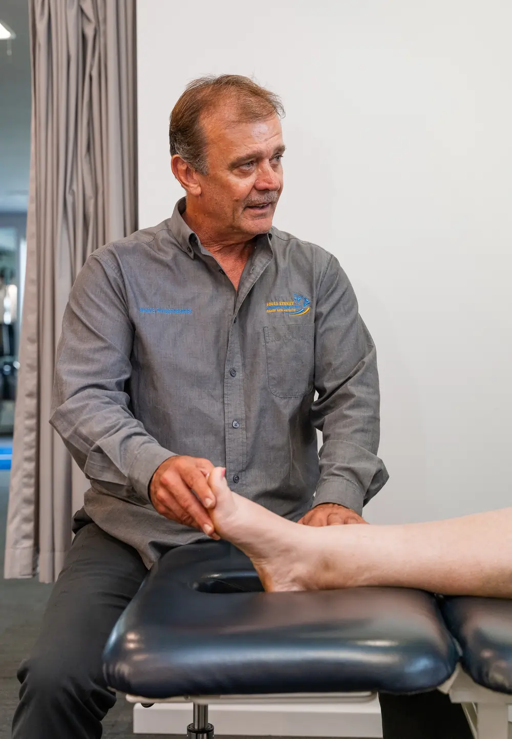 Physiotherapist Checking Ankle