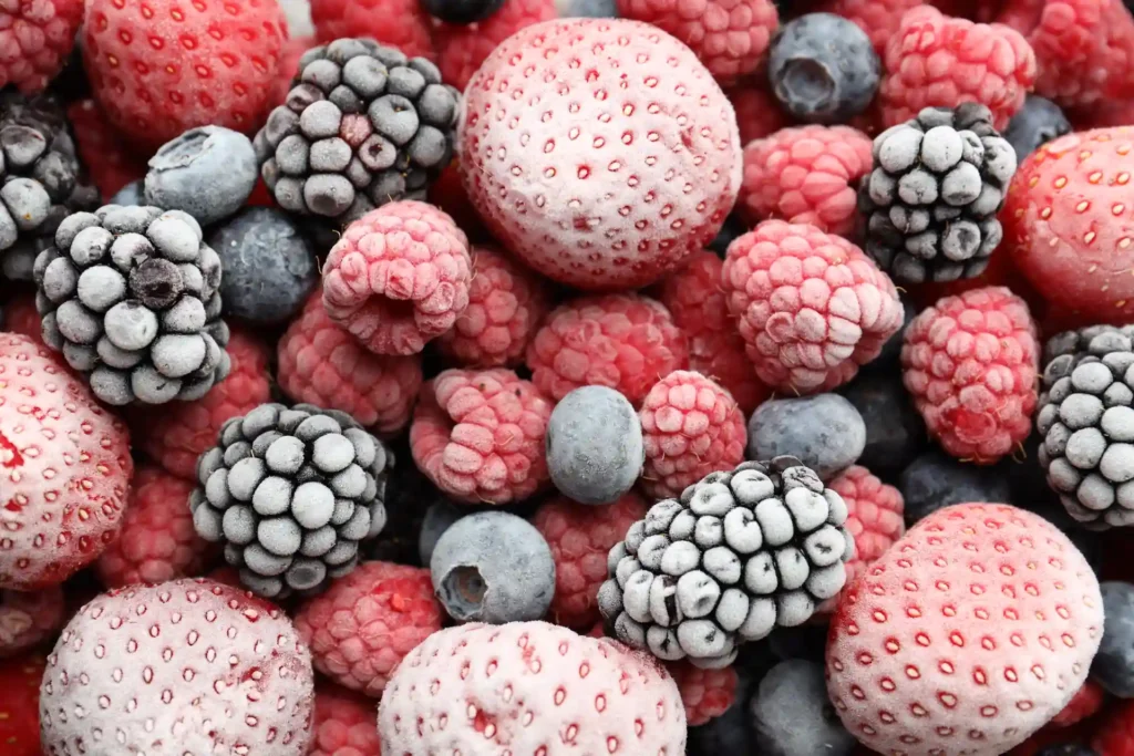 Close-up of frosted frozen strawberries, raspberries, blackberries and blueberries, popular options when anti-inflammatory foods are compared for Central Coast shoppers